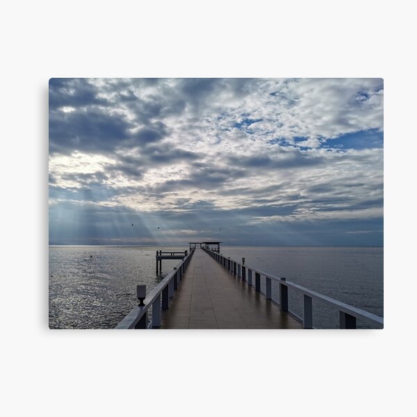 Item preview, A long wooden pier stretches out into the calm sea under a dramatic sky filled with clouds. designed and sold by BARTISTA DESIGN.