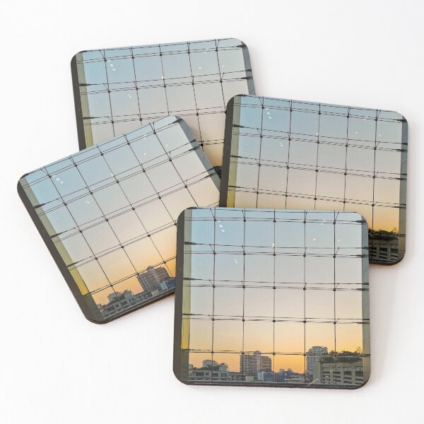 Item preview, A shot through a grid-like glass structure, revealing a cityscape at dusk. The sky transitions from a pale blue at the top to a warm orange glow near the horizon. designed and sold by BARTISTA DESIGN.