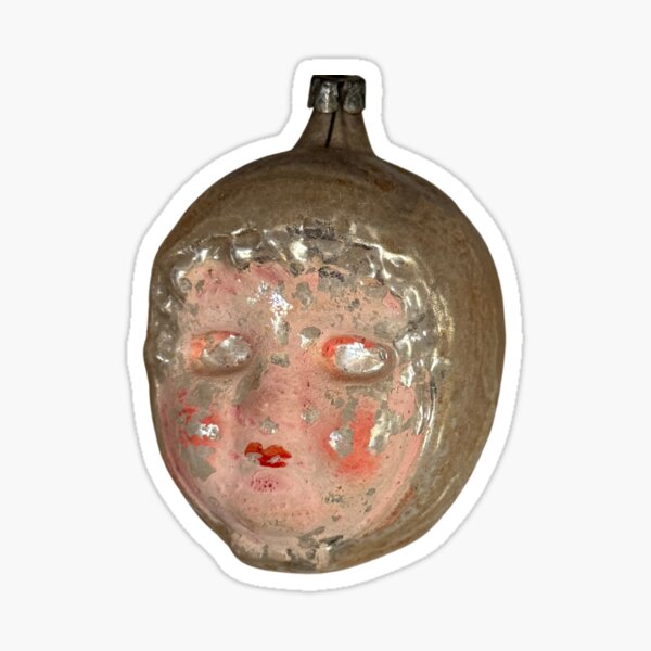 Aperçu de l'œuvre ORNEMENT DE NOËL ANTIQUE EN FORME DE VISAGE DE BÉBÉ créée et vendue par Chili Cake.
