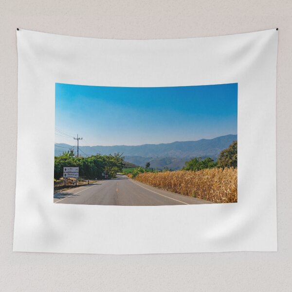 Item preview, Empty road and mountains against clear blue sky designed and sold by PitakChai93.