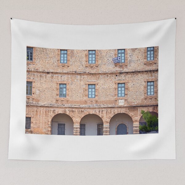 Item preview, An old stone building with a Greek flag, Syntagma Square, Nafplio,Greece designed and sold by goceris.