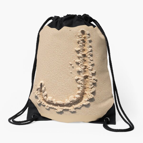 SAND LETTER J Drawstring Bag