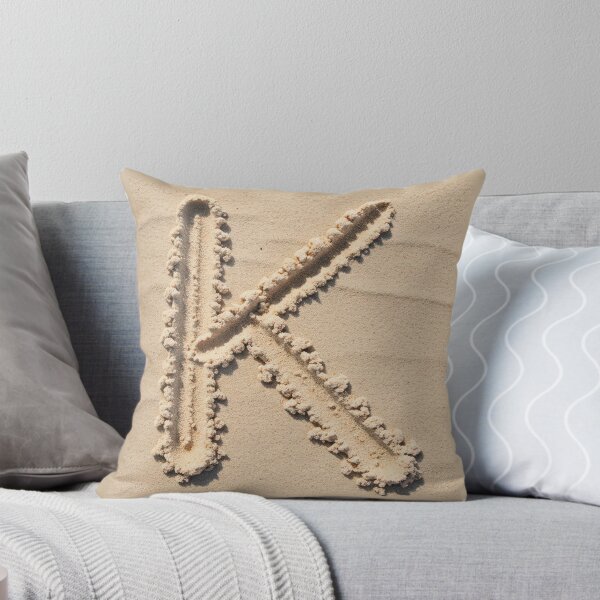 SAND LETTER K Throw Pillow