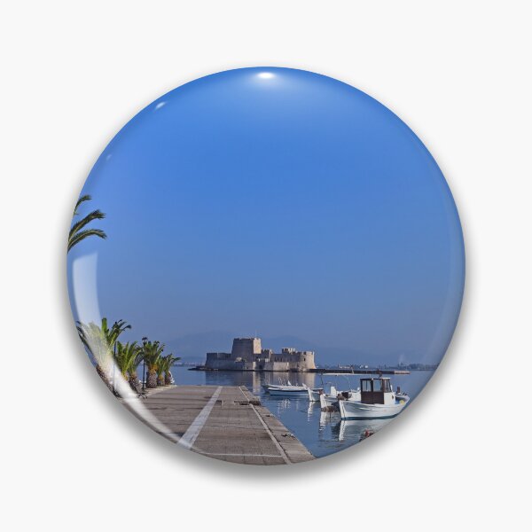 Item preview, Small white fishing boats and Bourtzi fortress in Nafplio, Peloponnese, Greece designed and sold by goceris.