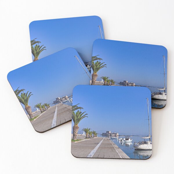 Item preview, Small white fishing boats and Bourtzi fortress in Nafplio, Peloponnese, Greece designed and sold by goceris.
