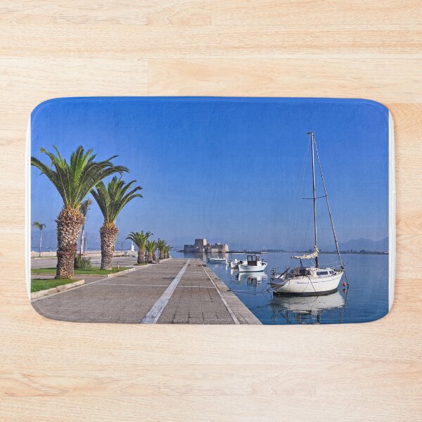 Item preview, Small white fishing boats and Bourtzi fortress in Nafplio, Peloponnese, Greece designed and sold by goceris.
