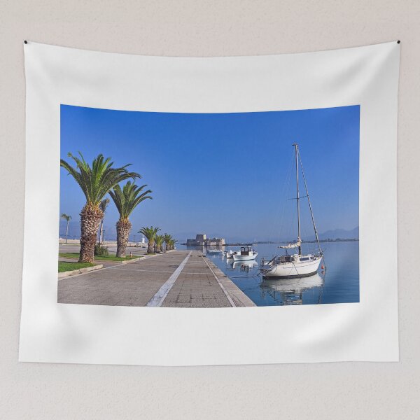 Item preview, Small white fishing boats and Bourtzi fortress in Nafplio, Peloponnese, Greece designed and sold by goceris.