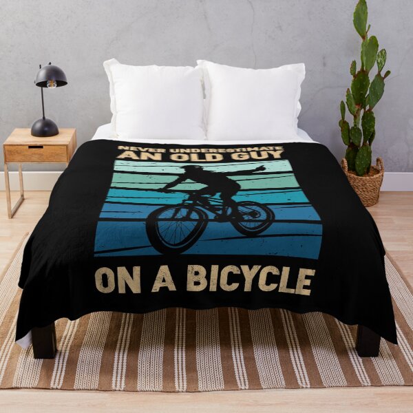 Item preview, Never Underestimate An Old Guy On A Bicycle designed and sold by mybegoniatee.