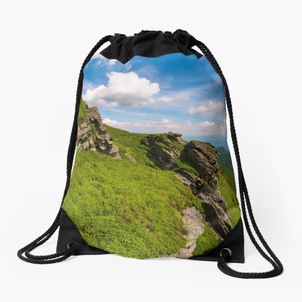 grassy hillside with boulders Drawstring Bag