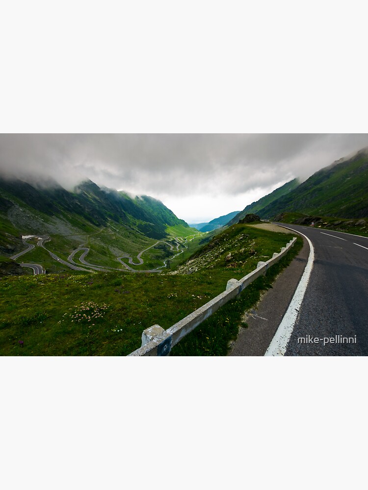 Thumbnail 3 of 3, Sticker, Transfagarasan road in stormy weather designed and sold by mike-pellinni.