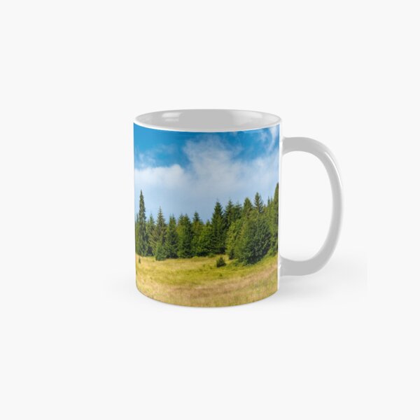 spruce forest on a grassy meadow Classic Mug