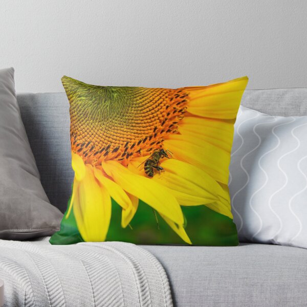 bees gathering pollen of the sunflower Throw Pillow
