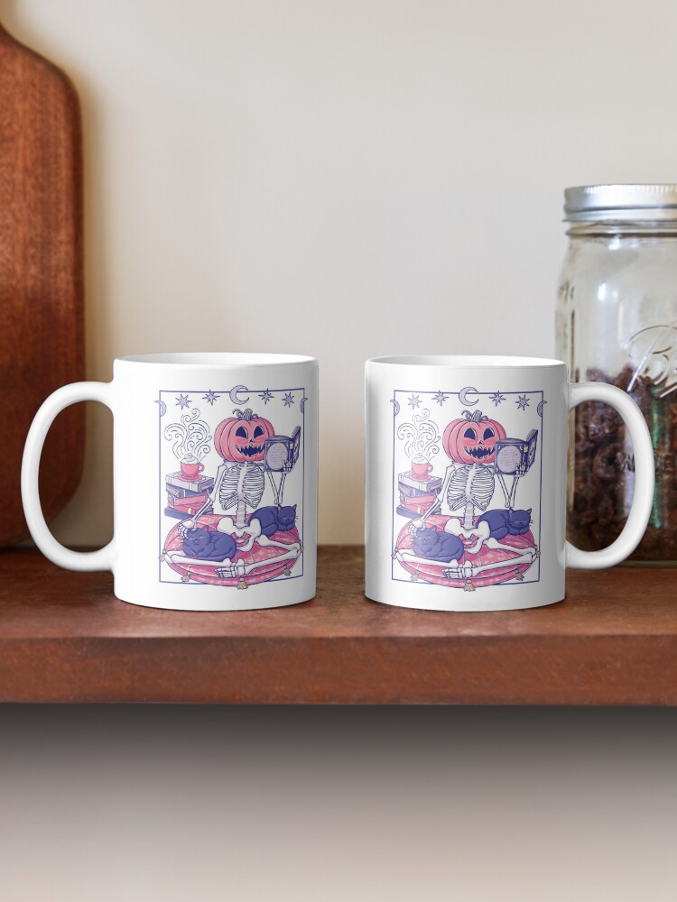 Thumbnail 2 of 6, Coffee Mug, Cute Pumpkin-Head Skeleton Reading With Cats designed and sold by StudioFloraLuna.