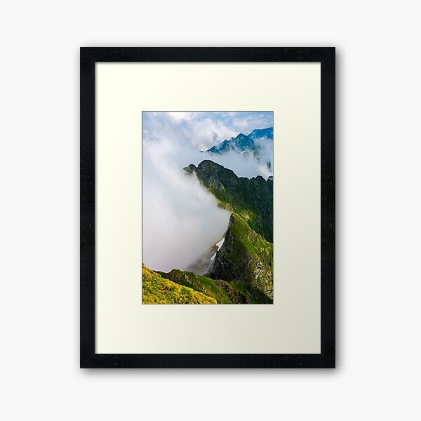 clouds rising in Fagaras mountains Framed Art Print