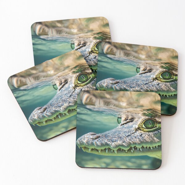 Item preview, Close-up of a crocodile underwater with piercing eyes designed and sold by Artessie.