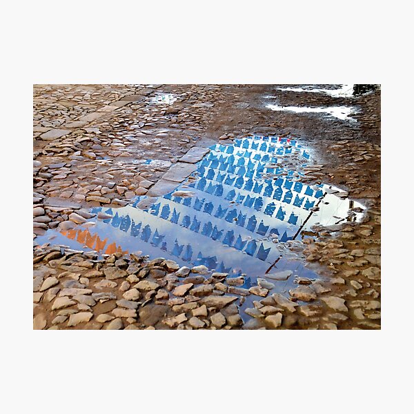 Item preview, São João's flags reflected in a puddle of water designed and sold by marilin-novak.