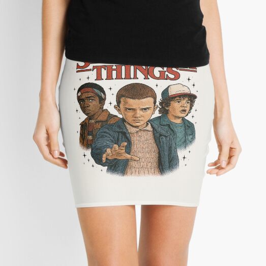 Item preview, Stranger Things kids in bold illustrated style, Eleven stands front with intense gaze, Dustin and Lucas behind, evoking 80s sci-fi nostalgia designed and sold by MystiS.