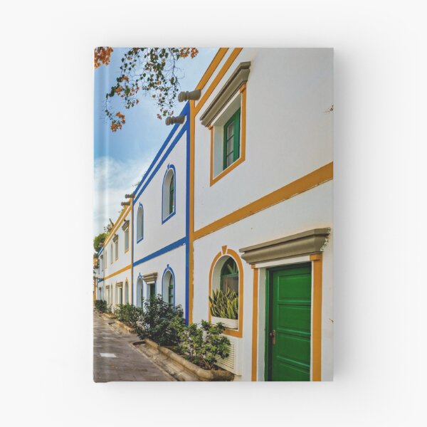 Item preview, Street with blooming flowers in Puerto de Mogan, Gran Canaria, Spain. Favorite vacation place for tourists and locals on island. Puerto de Mogan with lots of bougainvillea flowers, Canary Island. designed and sold by Framed Horizons.