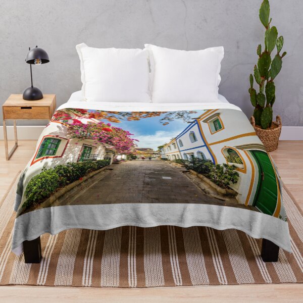 Item preview, Street with blooming flowers in Puerto de Mogan, Gran Canaria, Spain. Favorite vacation place for tourists and locals on island. Puerto de Mogan with lots of bougainvillea flowers, Canary Island. designed and sold by Framed Horizons.