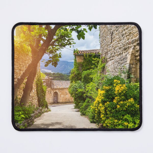 Item preview, Charming street in quaint Menerbes village with colorful buildings and vibrant flowers. Village of Menerbes (Most Beautiful Village in France) in the Luberon mountains, France, Luberon, Vaucluse. designed and sold by Framed Horizons.
