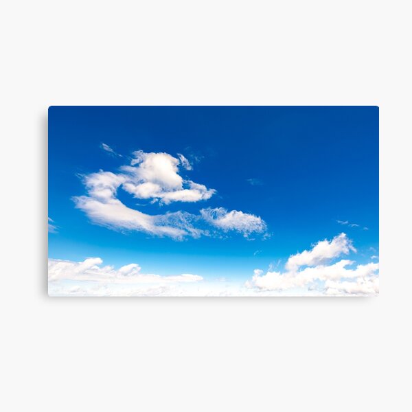 amazing cloud formations on a blue sky Canvas Print