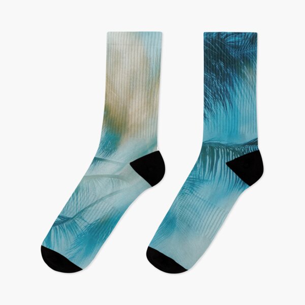 Item preview, Vibrant palm leaves against blue sky designed and sold by anytka.