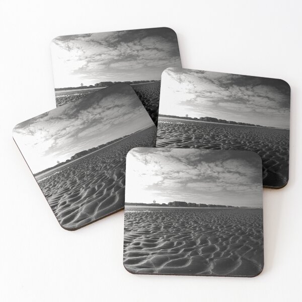 Item preview, Vast Sandy Beach With City Skyline Under Clear Blue Sky in black and white designed and sold by FotoMahieu.