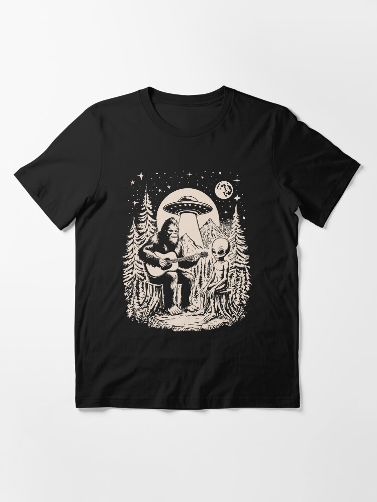 Thumbnail 3 of 7, Essential T-Shirt, Bigfoot Playing Guitar With Alien UFO Vintage Camping designed and sold by CutenessKlub.
