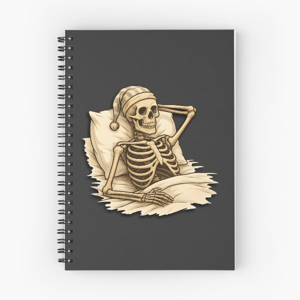 Item preview, Skelly the Skeleton being cozy in bed designed and sold by Relatable Tees.
