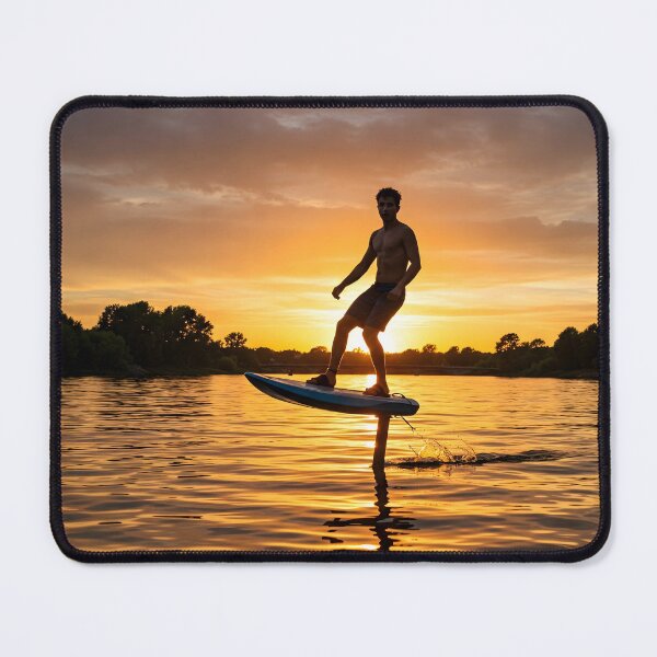 Item preview, Young adult male hydrofoiling on water at sunset, silhouetted against a vibrant orange and cloudy sky designed and sold by homydesign.