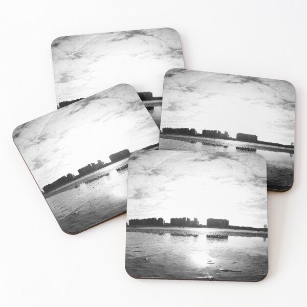 Item preview, Sunlit Beachfront View with Reflections and Skyscraper Silhouettes in black and white designed and sold by FotoMahieu.