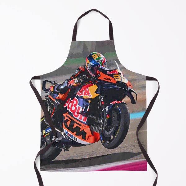 Artikelvorschau, Brad Binder fährt mit seinem 2025er MotoGP-Motorrad und beschleunigt aus der Kurve, wobei er einen kleinen Wheelie macht. entworfen und verkauft von Rodissimus1984.