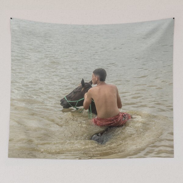 Item preview, Young man riding a horse in the river designed and sold by felipequeiroz.
