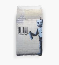 Banksy graffiti smiling Robot and barcodes Better Out Than In New York City residency on brick wall Duvet Cover