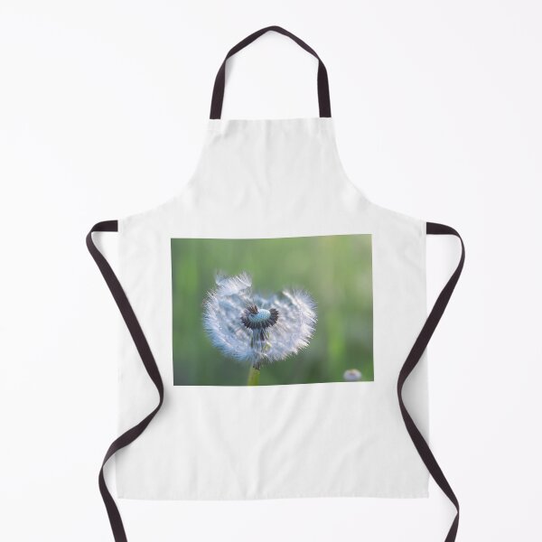 Item preview, Dandelion with seeds blowing away in the wind across a clear greenery designed and sold by Teqmi-images.