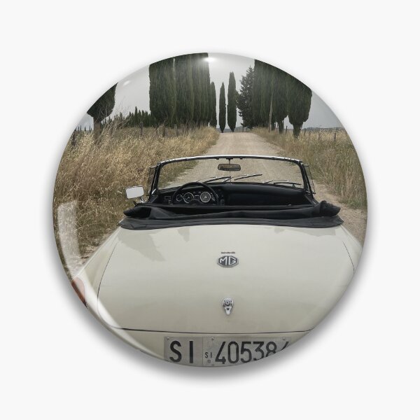 Item preview, MG MGB ina a field in Tuscany, surrounded by cypress, italian style travel car designed and sold by SpaceCars.
