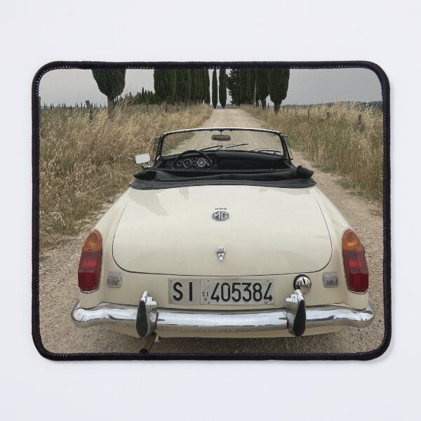 Item preview, MG MGB ina a field in Tuscany, surrounded by cypress, italian style travel car designed and sold by SpaceCars.