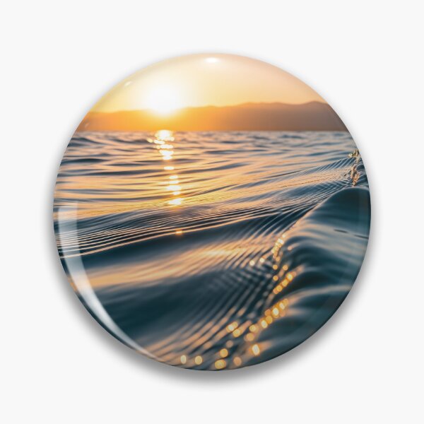 Item preview, Waves shimmer on the water's surface as the sun sets over distant mountains, creating a warm, golden glow designed and sold by homydesign.