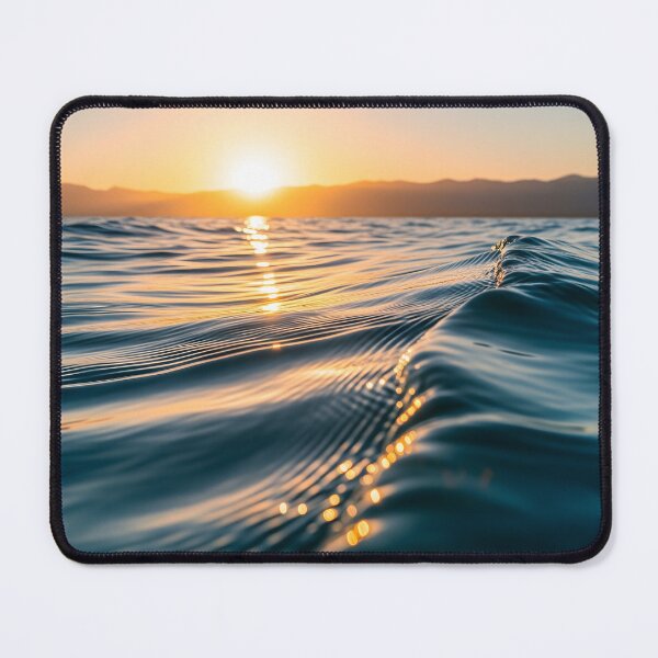 Item preview, Waves shimmer on the water's surface as the sun sets over distant mountains, creating a warm, golden glow designed and sold by homydesign.