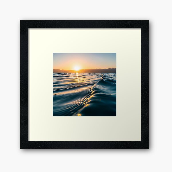Item preview, Waves shimmer on the water's surface as the sun sets over distant mountains, creating a warm, golden glow designed and sold by homydesign.