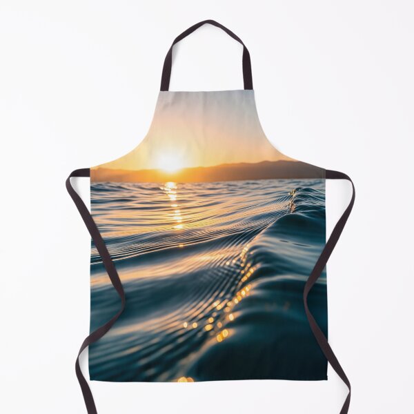 Item preview, Waves shimmer on the water's surface as the sun sets over distant mountains, creating a warm, golden glow designed and sold by homydesign.