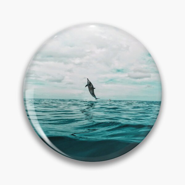 Item preview, Spinner dolphin leaping out of the water at Waimea Bay  designed and sold by Hawaii Wildlife & Landscape Prints.