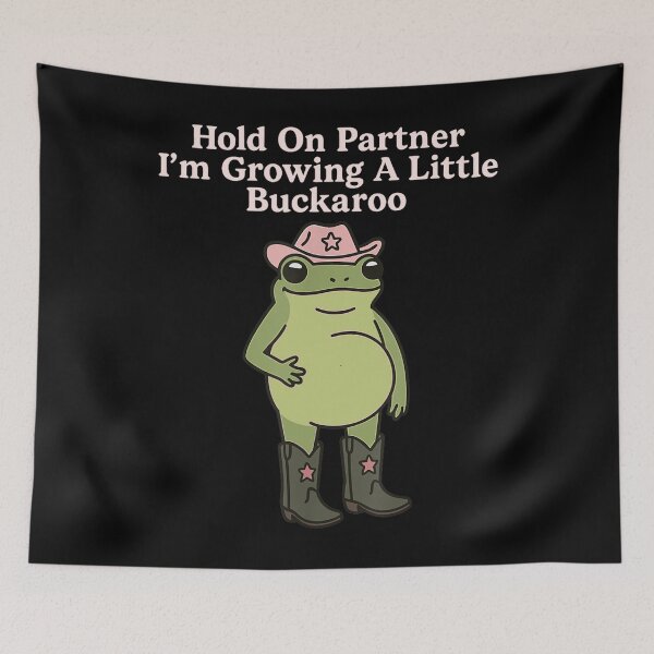 Item preview, Funny Frog - Hold On Partner I'm Growing A Little Buckaroo designed and sold by chung2525.