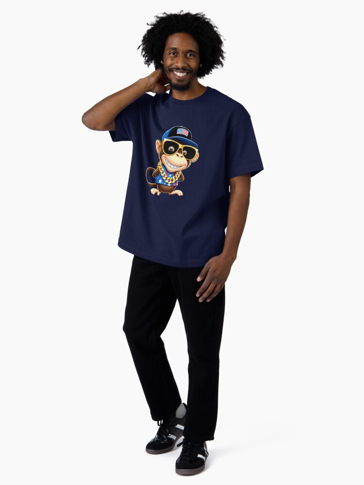 Aperçu 4 sur 7. T-shirt oversize avec l'œuvre whimsical cartoon monkey, with a mischievous grin and bright créée et vendue par 1onemarket.