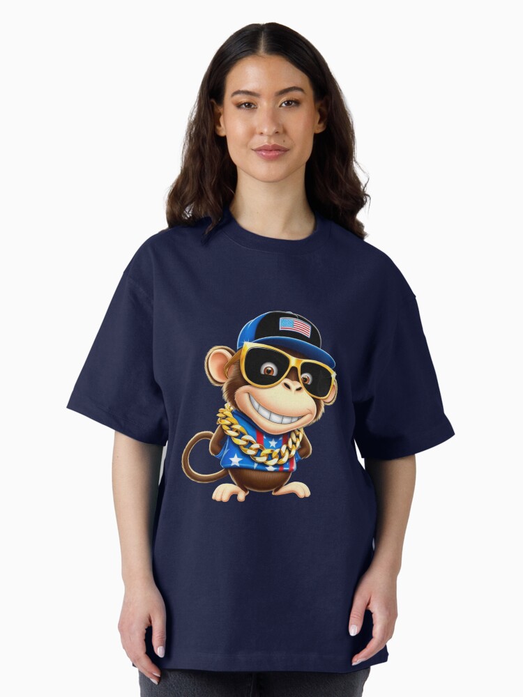 Aperçu 2 sur 7. T-shirt oversize avec l'œuvre whimsical cartoon monkey, with a mischievous grin and bright créée et vendue par 1onemarket.