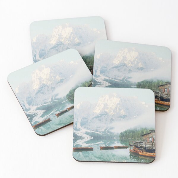 Item preview, Dolomites, Italy I Lago di Braies lake with its wooden cabin and boats in front of the snow mountain from morning mist fog to the moody aesthetic atmosphere of sunrise pastel light in misty forest designed and sold by Julie Travel Photography.