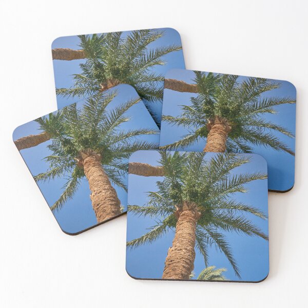 Item preview, date palm growing against blue sky designed and sold by IgorKovalenko.