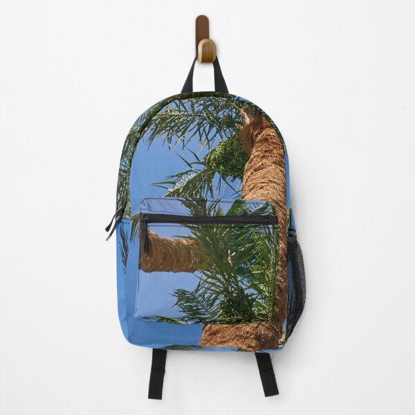 Item preview, date palm growing against blue sky designed and sold by IgorKovalenko.