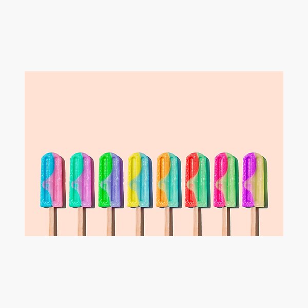Row of rainbow-colored icecream lollies Photographic Print