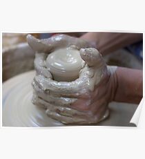 Making a clay pot on a potter's wheel Poster